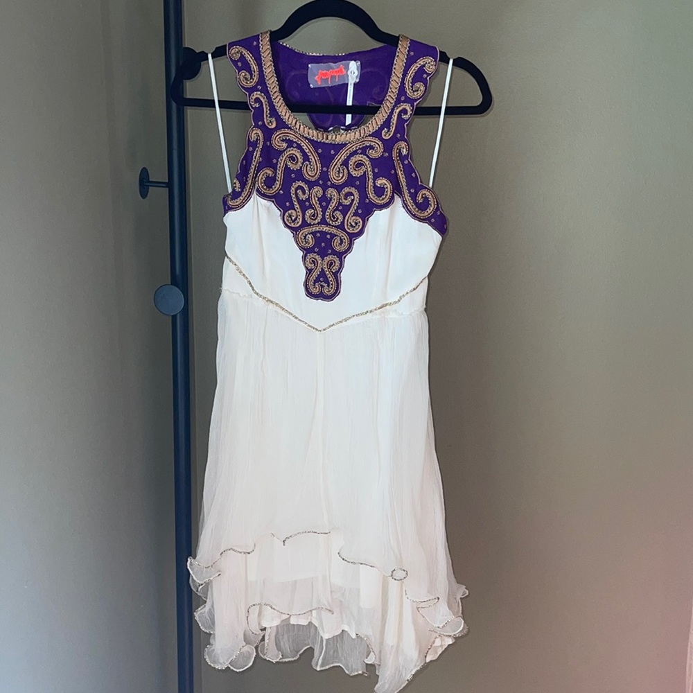 Free People, size 6 gauze dress with dark purple and dark gold embroidery.